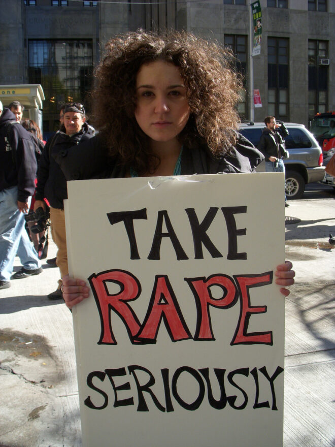"Take rape seriously" - Protester with Placard Reproductive rights activist Shelby Knox.