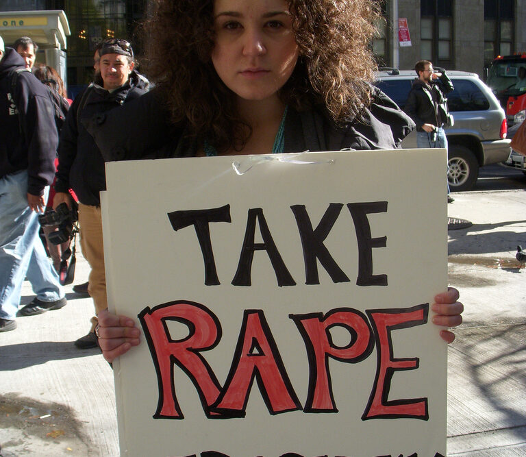 "Take rape seriously" - Protester with Placard Reproductive rights activist Shelby Knox.